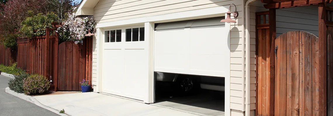 Fix Metal Garage Door Jerking in Gravenhurst, Ontario